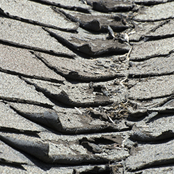 A roof with curled shingles.